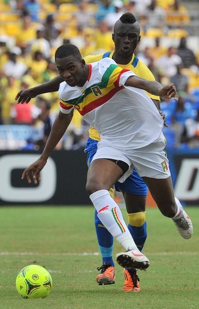 Gabon's striker Eric Mouloungui (back) v